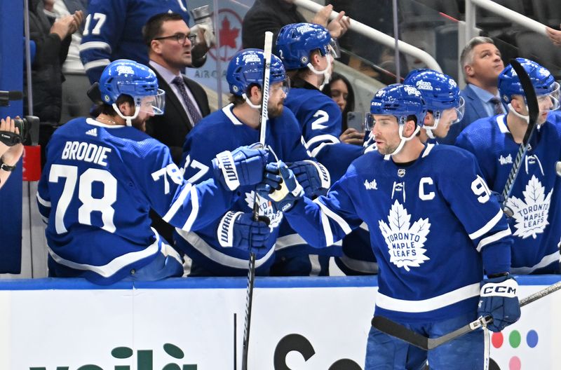 Feb 7, 2024; Toronto, Ontario, CAN; Toronto Maple Leafs forward John Tavares (91) celebrates with defenseman TJ Brodie (78) after scoring a goal against the Dallas Stars in the second period at Scotiabank Arena. Mandatory Credit: Dan Hamilton-USA TODAY Sports