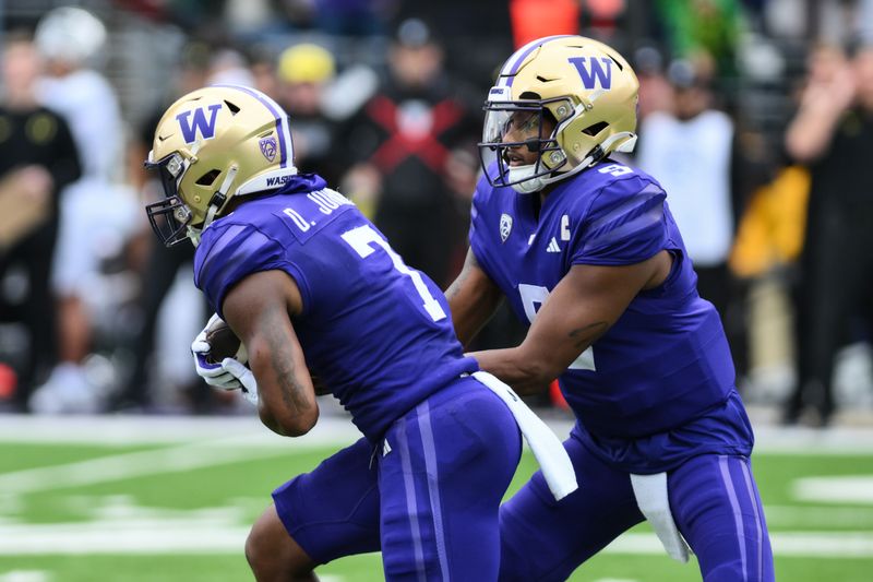 Oct 14, 2023; Seattle, Washington, USA; Washington Huskies quarterback Michael Penix Jr. (9) hands the ball off to running back Dillon Johnson (7) during the first half against the Oregon Ducks at Alaska Airlines Field at Husky Stadium. Mandatory Credit: Steven Bisig-USA TODAY Sports