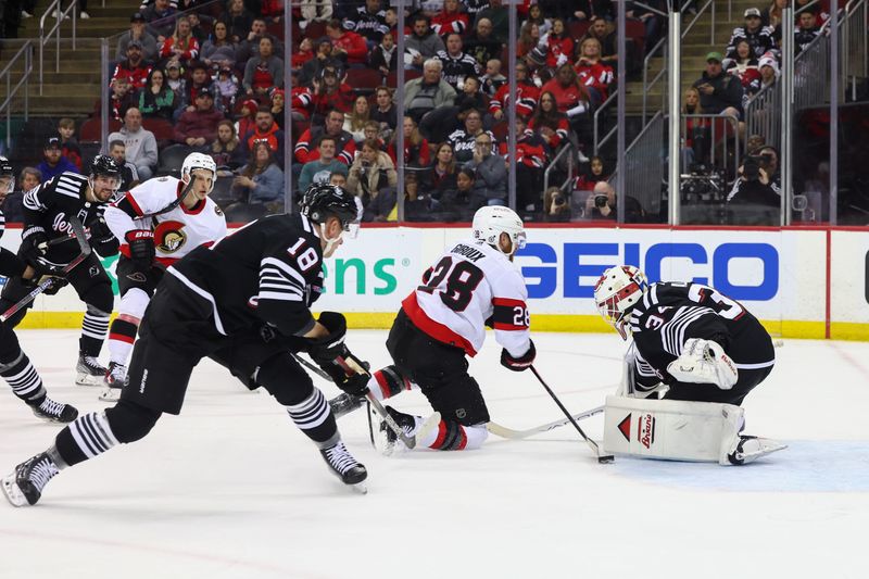 Mar 23, 2024; Newark, New Jersey, USA; New Jersey Devils goaltender Jake Allen (34) makes a save on Ottawa Senators right wing Claude Giroux (28) during the first period at Prudential Center. Mandatory Credit: Ed Mulholland-USA TODAY Sports