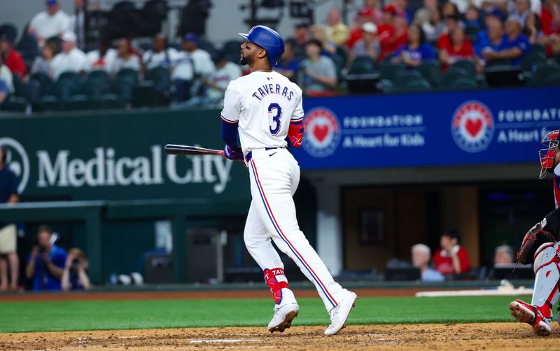 Apr 30, 2024; Arlington, Texas, USA;  Texas Rangers center fielder Leody Taveras (3) hits a two-run home run during the eighth inning against the Washington Nationals at Globe Life Field. Mandatory Credit: Kevin Jairaj-USA TODAY Sports