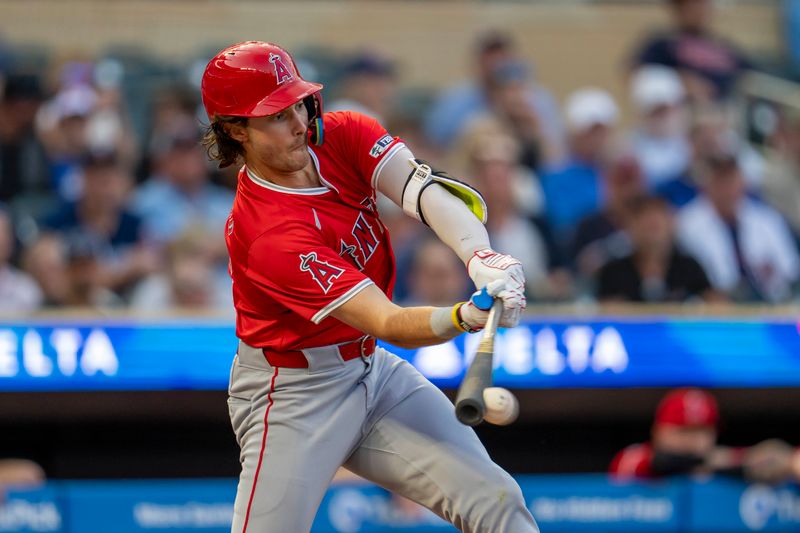 Sep 9, 2024; Minneapolis, Minnesota, USA; Los Angeles Angels center fielder Bryce Teodosio (22) hits a ground ball against the Minnesota Twins in the second inning at Target Field. Mandatory Credit: Jesse Johnson-Imagn Images