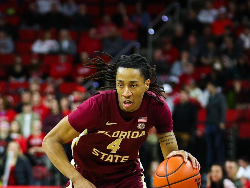 Feb 1, 2023; Raleigh, North Carolina, USA; Florida State Seminoles guard Caleb Mills (4) dribbles during the second half against North Carolina State Wolfpack at PNC Arena.  Mandatory Credit: Jaylynn Nash-USA TODAY Sports