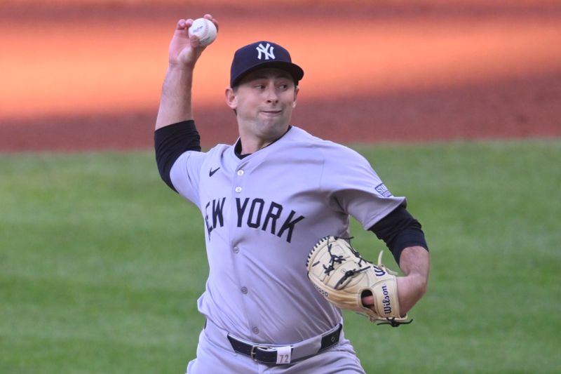 Apr 13, 2024; Cleveland, Ohio, USA; New York Yankees starting pitcher Cody Poteet (72) delivers a pitch in the first inning against the Cleveland Guardians at Progressive Field. Mandatory Credit: David Richard-USA TODAY Sports