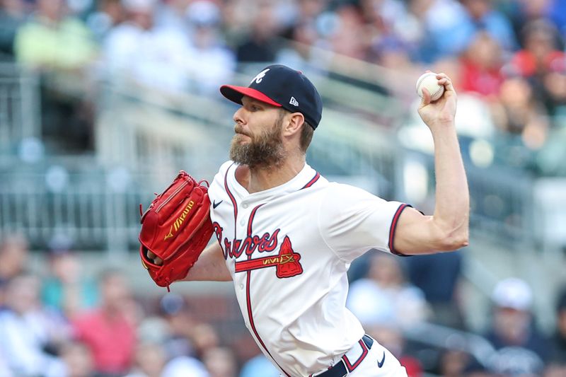 May 6, 2025; Cumberland, Georgia, USA; Atlanta Braves pitcher Chris Sale (51) pitches ball against the Cincinnati Reds during the first inning at Truist Park. Mandatory Credit: Jordan Godfree-Imagn Images