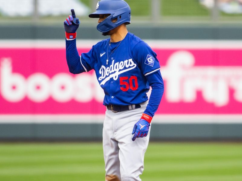 Feb 26, 2024; Salt River Pima-Maricopa, Arizona, USA; Los Angeles Dodgers infielder Mookie Betts celebrates an RBI double against the Colorado Rockies during a spring training game at Salt River Fields at Talking Stick. Mandatory Credit: Mark J. Rebilas-USA TODAY Sports
