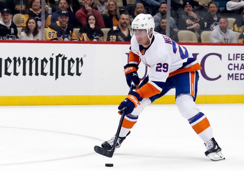 Mar 9, 2023; Pittsburgh, Pennsylvania, USA;  New York Islanders center Brock Nelson (29) skates in on a breakaway before scoring the game winning goal against the Pittsburgh Penguins in overtime at PPG Paints Arena. The Islanders won 4-3 in overtime. Mandatory Credit: Charles LeClaire-USA TODAY Sports