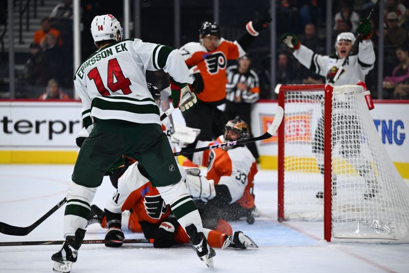 Oct 26, 2024; Philadelphia, Pennsylvania, USA; Minnesota Wild center Joel Eriksson Ek (14) scores a goal against the Philadelphia Flyers in the second period at Wells Fargo Center. Mandatory Credit: Kyle Ross-Imagn Images