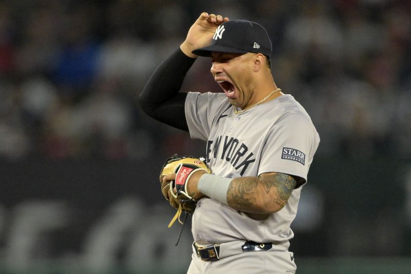 May 30, 2024; Anaheim, California, USA;  New York Yankees second baseman Gleyber Torres (25) yawns on the field in the seventh inning against the Los Angeles Angels at Angel Stadium. Mandatory Credit: Jayne Kamin-Oncea-USA TODAY Sports