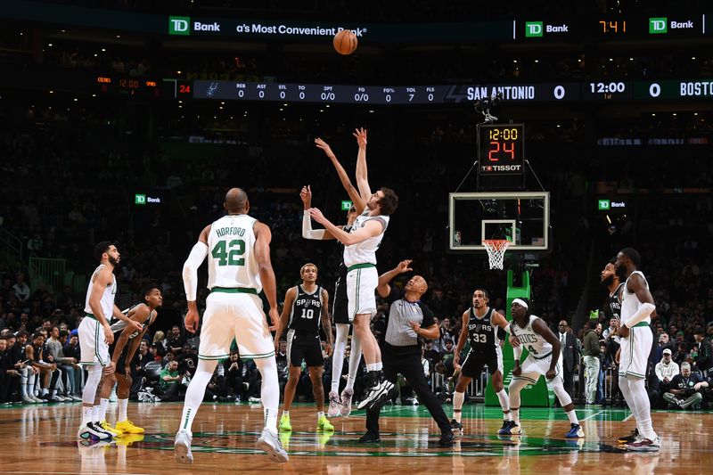 BOSTON, MA - JANUARY 17: Victor Wembanyama #1 of the San Antonio Spurs and Luke Kornet #40 of the Boston Celtics go up for the opening tip off on January 17, 2024 at the TD Garden in Boston, Massachusetts. NOTE TO USER: User expressly acknowledges and agrees that, by downloading and or using this photograph, User is consenting to the terms and conditions of the Getty Images License Agreement. Mandatory Copyright Notice: Copyright 2024 NBAE  (Photo by Brian Babineau/NBAE via Getty Images)