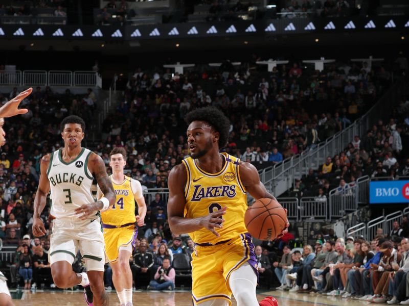 MILWAUKEE, WI - OCTOBER 10: Bronny James #9 of the Los Angeles Lakers drives to the basket during the game against the Milwaukee Bucks during a preseason game on October 10, 2024 at Fiserv Forum Center in Milwaukee, Wisconsin. NOTE TO USER: User expressly acknowledges and agrees that, by downloading and or using this Photograph, user is consenting to the terms and conditions of the Getty Images License Agreement. Mandatory Copyright Notice: Copyright 2024 NBAE (Photo by Gary Dineen/NBAE via Getty Images).