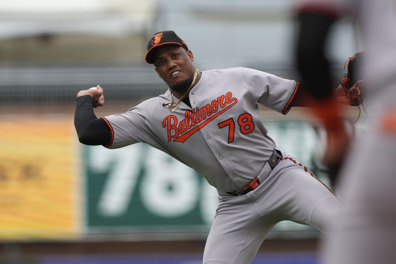 Jun 8, 2025; West Sacramento, California, USA; Baltimore Orioles pitcher Yennier Cano (78) throws the ball to first base to record an out against the Athletics during the seventh inning at Sutter Health Park. Mandatory Credit: Darren Yamashita-Imagn Images