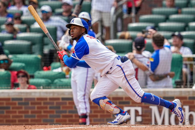 Jul 30, 2023; Cumberland, Georgia, USA; Atlanta Braves second baseman Ozzie Albies (1) runs after hitting a double against the Milwaukee Brewers during the eighth inning at Truist Park. Mandatory Credit: Dale Zanine-USA TODAY Sports