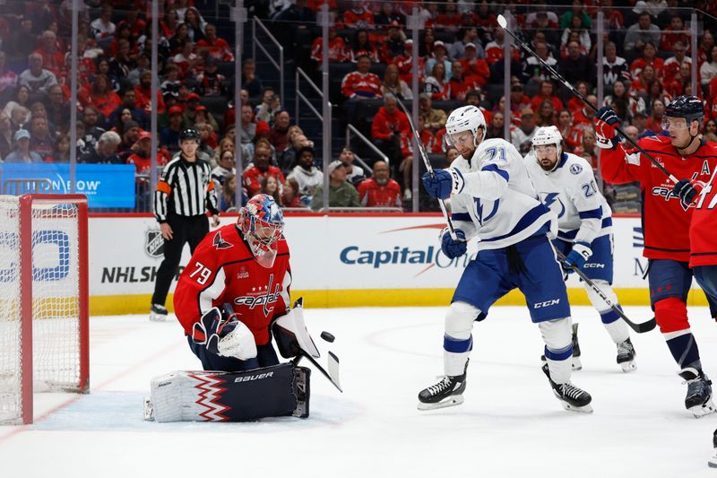 Apr 13, 2024; Washington, District of Columbia, USA; Washington Capitals goaltender Charlie Lindgren (79) makes a save on Tampa Bay Lightning center Anthony Cirelli (71) in the second period at Capital One Arena. Mandatory Credit: Geoff Burke-USA TODAY Sports