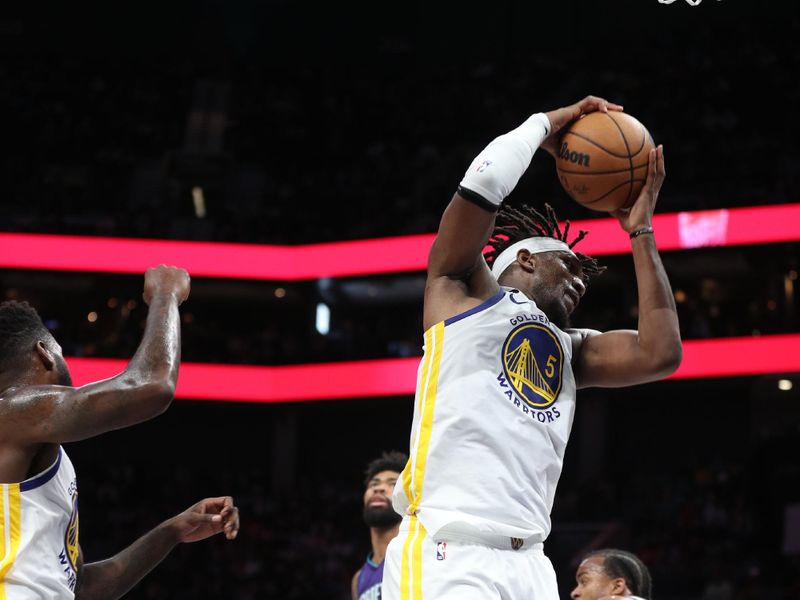 CHARLOTTE, NC - OCTOBER 29: Kevon Looney #5 of the Golden State Warriors grabs the rebound during the game against the Charlotte Hornets on October 29, 2022 at Spectrum Center in Charlotte, North Carolina. NOTE TO USER: User expressly acknowledges and agrees that, by downloading and or using this photograph, User is consenting to the terms and conditions of the Getty Images License Agreement.  Mandatory Copyright Notice:  Copyright 2022 NBAE (Photo by Brock Williams-Smith/NBAE via Getty Images)