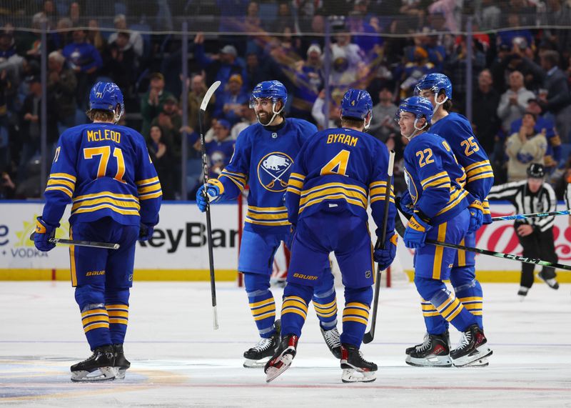 Oct 22, 2025; Buffalo, New York, USA;  Buffalo Sabres right wing Jack Quinn (22) celebrates his goal with teammates during the third period against the Detroit Red Wings at KeyBank Center. Mandatory Credit: Timothy T. Ludwig-Imagn Images