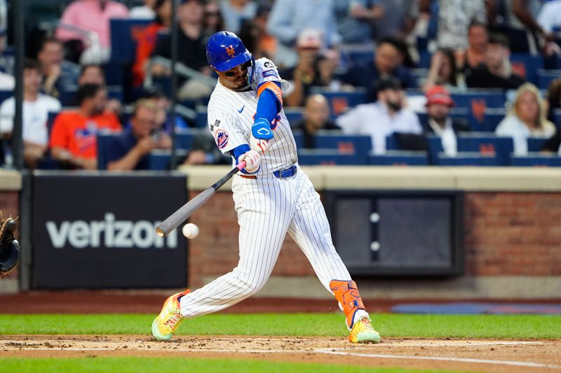 Aug 19, 2024; New York City, New York, USA; New York Mets third baseman Mark Vientos (27) hits a single against the Baltimore Orioles during the first inning at Citi Field. Mandatory Credit: Gregory Fisher-USA TODAY Sports