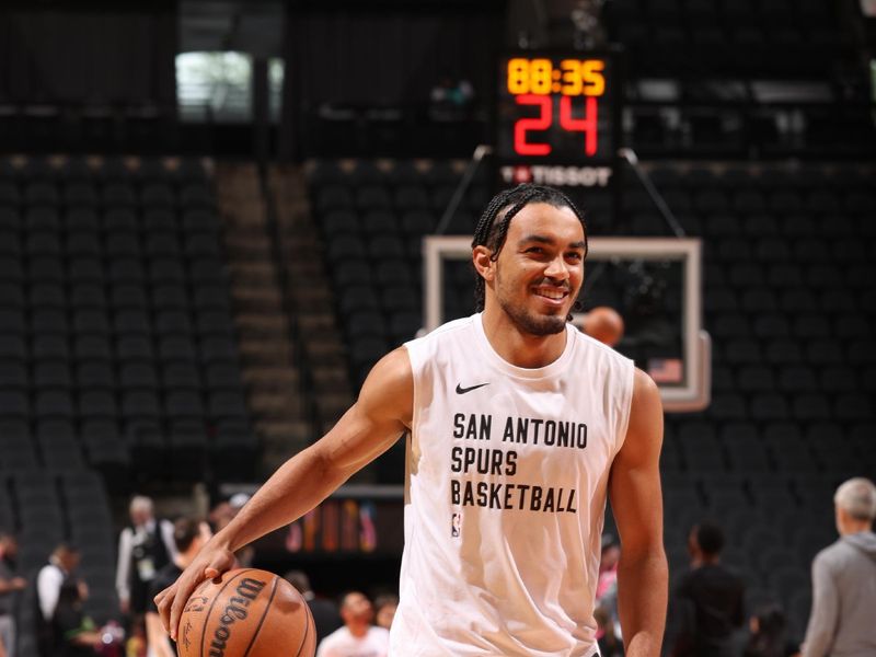 SAN ANTONIO, TX - MARCH 31: Tre Jones #33 of the San Antonio Spurs warms up before the game against the Golden State Warriors on March 31, 2024 at the Frost Bank Center in San Antonio, Texas. NOTE TO USER: User expressly acknowledges and agrees that, by downloading and or using this photograph, user is consenting to the terms and conditions of the Getty Images License Agreement. Mandatory Copyright Notice: Copyright 2024 NBAE (Photos by Joe Murphy/NBAE via Getty Images)