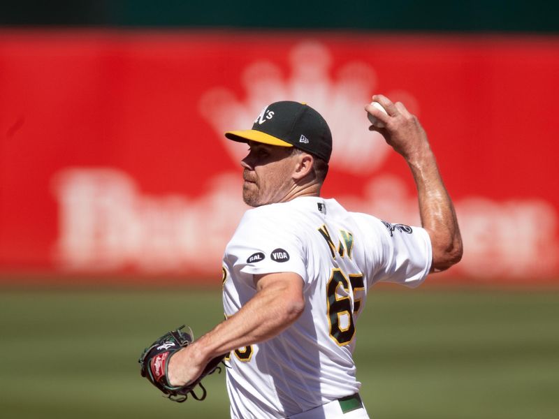 Sep 6, 2023; Oakland, California, USA; Oakland Athletics pitcher Trevor May (65) delivers a pitch against the Toronto Blue Jays during the ninth inning at Oakland-Alameda County Coliseum. Mandatory Credit: D. Ross Cameron-USA TODAY Sports