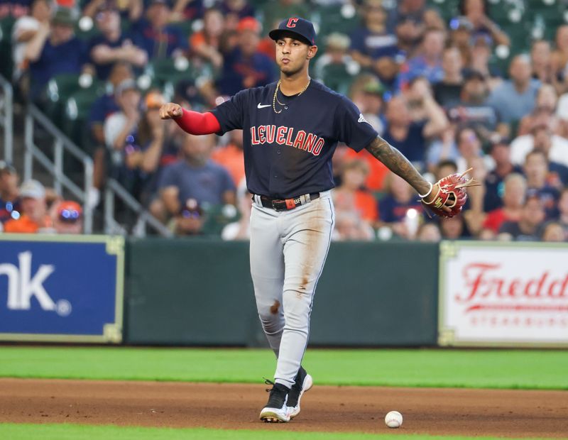 Aug 2, 2023; Houston, Texas, USA; Cleveland Guardians third baseman Brayan Rocchio (6) drops the ball after fielding a grounder by Houston Astros third baseman Alex Bregman (2) (not pictured) in the seventh inning at Minute Maid Park. Mandatory Credit: Thomas Shea-USA TODAY Sports