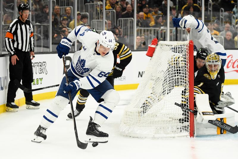 Apr 20, 2024; Boston, Massachusetts, USA; Toronto Maple Leafs center David Kampf (64) controls the puck while Boston Bruins goaltender Jeremy Swayman (1) looks on during the second period in game one of the first round of the 2024 Stanley Cup Playoffs at TD Garden. Mandatory Credit: Bob DeChiara-USA TODAY Sports