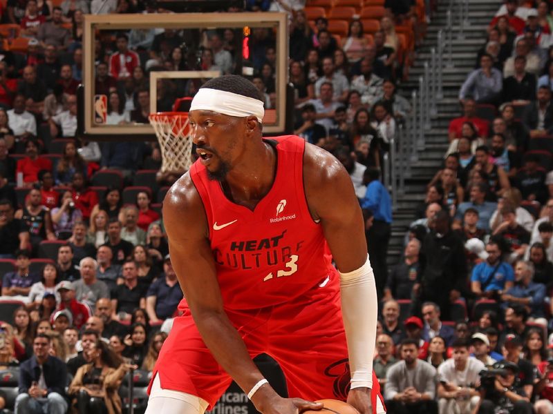 MIAMI, FL - NOVEMBER 18: Bam Adebayo #13 of the Miami Heat handles the ball during the game against the Philadelphia 76ers on November 18, 2024 at Kaseya Center in Miami, Florida. NOTE TO USER: User expressly acknowledges and agrees that, by downloading and or using this Photograph, user is consenting to the terms and conditions of the Getty Images License Agreement. Mandatory Copyright Notice: Copyright 2024 NBAE (Photo by Issac Baldizon/NBAE via Getty Images)