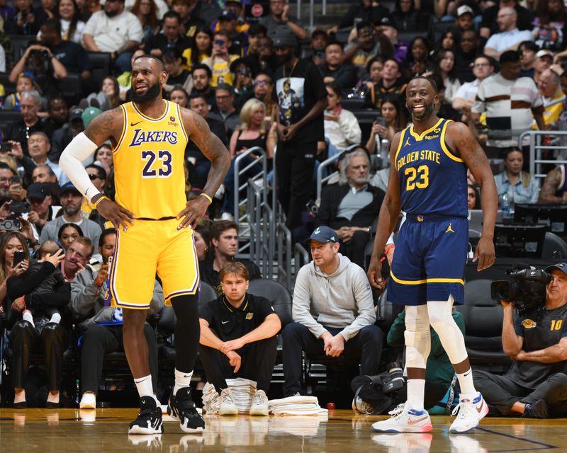 LOS ANGELES, CA - APRIL 9: LeBron James #23 of the Los Angeles Lakers and Draymond Green #23 of the Golden State Warriors looks on during the game on April 9, 2024 at Crypto.Com Arena in Los Angeles, California. NOTE TO USER: User expressly acknowledges and agrees that, by downloading and/or using this Photograph, user is consenting to the terms and conditions of the Getty Images License Agreement. Mandatory Copyright Notice: Copyright 2024 NBAE (Photo by Andrew D. Bernstein/NBAE via Getty Images)