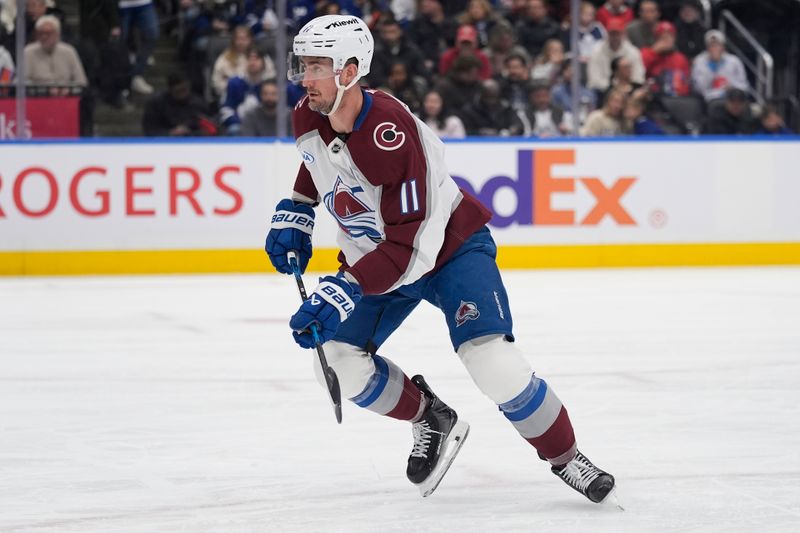 Jan 25, 2026; Toronto, Ontario, CAN; Colorado Avalanche forward Brock Nelson (11) skates against the Toronto Maple Leafs during the second period at Scotiabank Arena. Mandatory Credit: John E. Sokolowski-Imagn Images