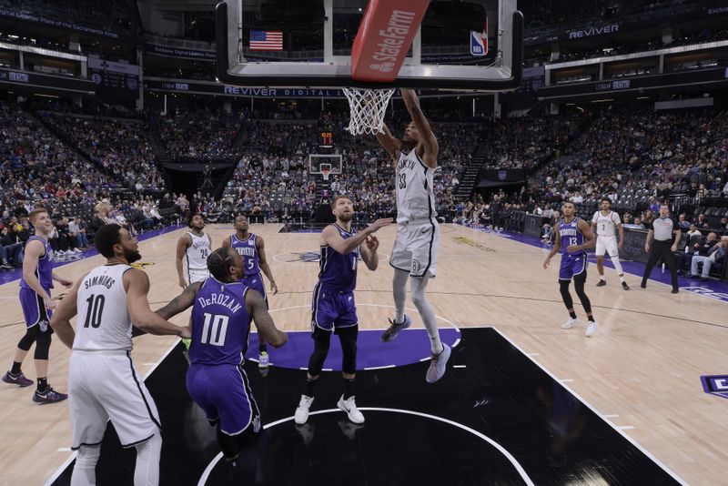 SACRAMENTO, CA - NOVEMBER 24: Nicolas Claxton #33 of the Brooklyn Nets dunks the ball during the game against the Sacramento Kings on November 24, 2024 at Golden 1 Center in Sacramento, California. NOTE TO USER: User expressly acknowledges and agrees that, by downloading and or using this Photograph, user is consenting to the terms and conditions of the Getty Images License Agreement. Mandatory Copyright Notice: Copyright 2024 NBAE (Photo by Rocky Widner/NBAE via Getty Images)