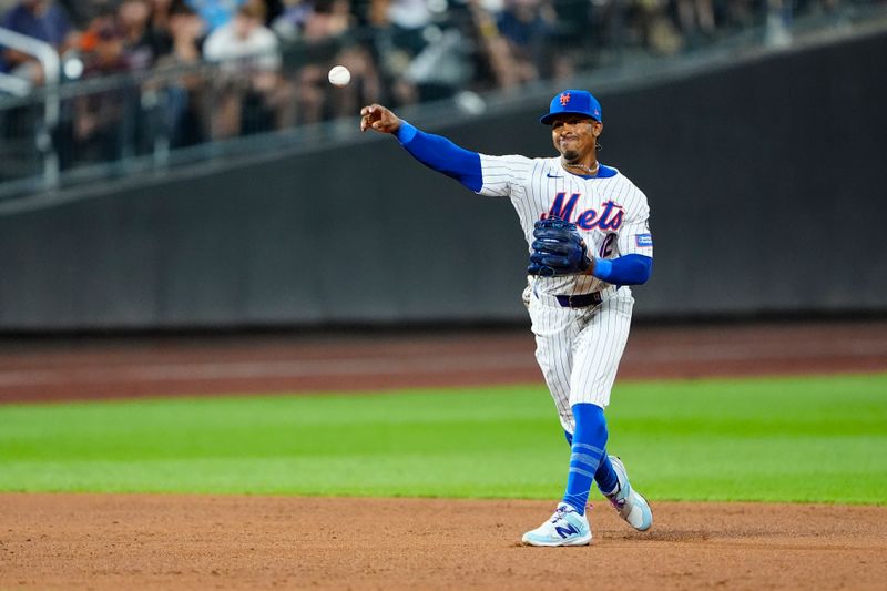 Aug 19, 2024; New York City, New York, USA; New York Mets shortstop Francisco Lindor (12) throws out Baltimore Orioles left fielder Austin Slater (not pictured) after fielding a ground ball during the fifth inning at Citi Field. Mandatory Credit: Gregory Fisher-USA TODAY Sports