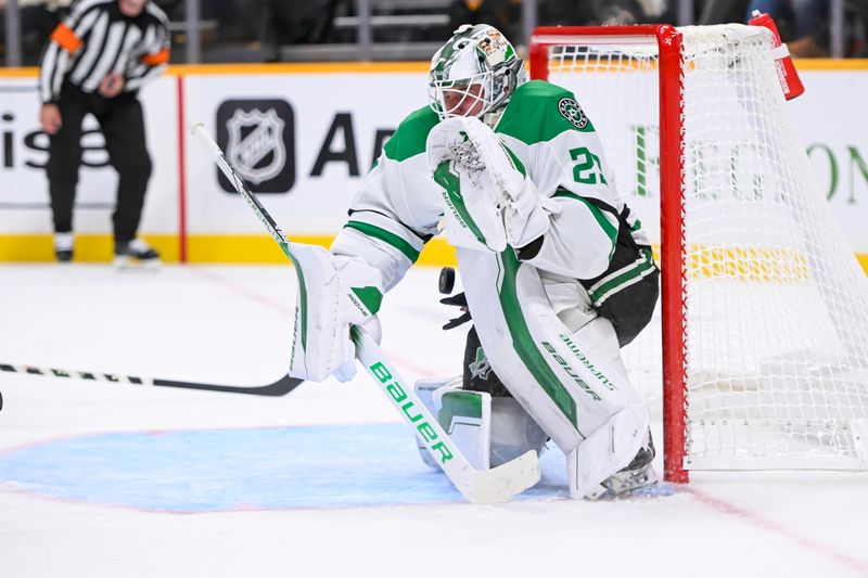 Oct 10, 2024; Nashville, Tennessee, USA; Dallas Stars goaltender Jake Oettinger (29) blocks the shot of Nashville Predators center Ryan O'Reilly (90) during the third period at Bridgestone Arena. Mandatory Credit: Steve Roberts-Imagn Images