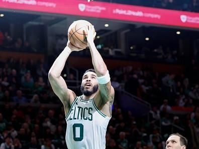 Boston, MA - December 28: Boston Celtics SF Jayson Tatum shoots a lay-up in the second half. The Celtics beat the Detroit Pistons, 128-122, in overtime. (Photo by Danielle Parhizkaran/The Boston Globe via Getty Images)