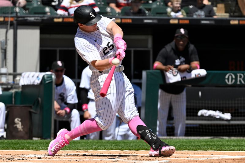 May 12, 2024; Chicago, Illinois, USA;  Chicago White Sox first base Andrew Vaughn (25) hits a double against the Cleveland Guardians during the first inning at Guaranteed Rate Field. Mandatory Credit: Matt Marton-USA TODAY Sports