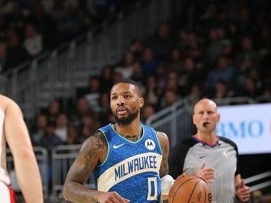 MILWAUKEE, WI - NOVEMBER 24: Damian Lillard #0 of the Milwaukee Bucks brings the ball up court against the Washington Wizards during the In-Season Tournament on November 24, 2023 at the Fiserv Forum Center in Milwaukee, Wisconsin. NOTE TO USER: User expressly acknowledges and agrees that, by downloading and or using this Photograph, user is consenting to the terms and conditions of the Getty Images License Agreement. Mandatory Copyright Notice: Copyright 2023 NBAE (Photo by Gary Dineen/NBAE via Getty Images).