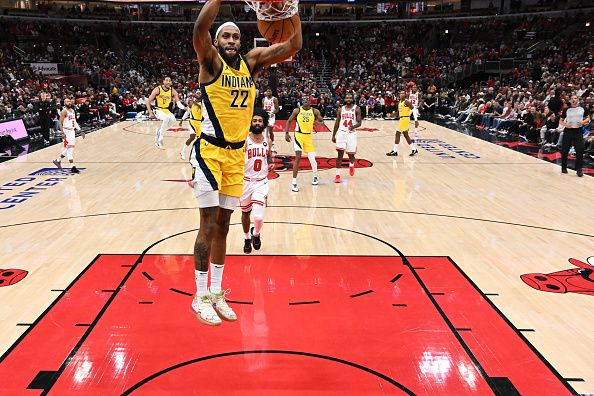 CHICAGO, ILLINOIS - DECEMBER 28:  Isaiah Jackson #22 of the Indiana Pacers finishes off a fast break with a dunk in the first half against the Chicago Bulls on December 28, 2023 at the United Center in Chicago, Illinois. Indiana defeated Chicago 120-104.   NOTE TO USER: User expressly acknowledges and agrees that, by downloading and or using this photograph, User is consenting to the terms and conditions of the Getty Images License Agreement.  (Photo by Jamie Sabau/Getty Images)