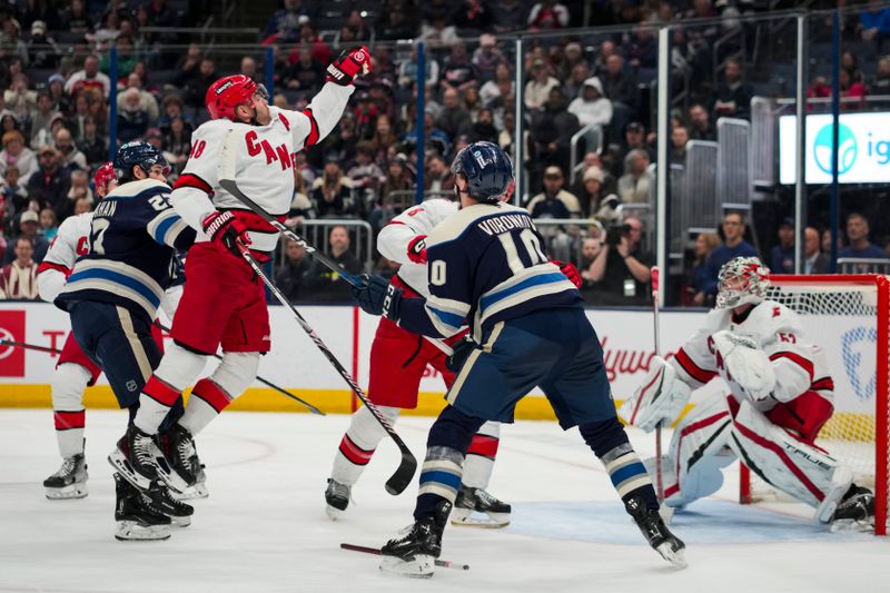 Nov 23, 2024; Columbus, Ohio, USA;  Carolina Hurricanes left wing Jordan Martinook (48) leaps as he plays the puck in the air, in the game against the Columbus Blue Jackets in the second period at Nationwide Arena. Mandatory Credit: Aaron Doster-Imagn Images