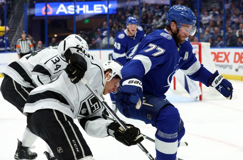 Jan 9, 2024; Tampa, Florida, USA; Tampa Bay Lightning defenseman Victor Hedman (77) defends Los Angeles Kings center Blake Lizotte (46)  during the second period at Amalie Arena. Mandatory Credit: Kim Klement Neitzel-USA TODAY Sports