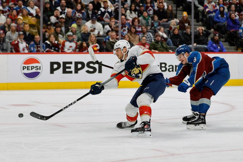 Jan 6, 2024; Denver, Colorado, USA; Florida Panthers center Sam Reinhart (13) scores on a breakaway ahead of Colorado Avalanche defenseman Cale Makar (8) in the first period at Ball Arena. Mandatory Credit: Isaiah J. Downing-USA TODAY Sports