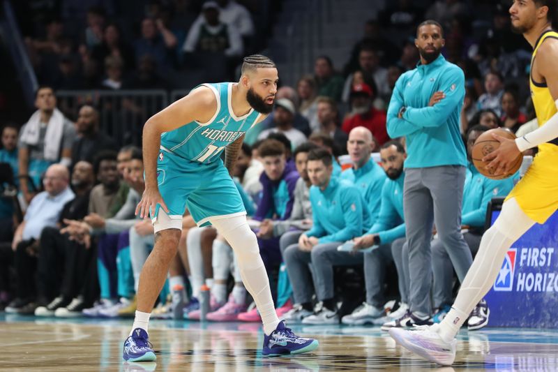 CHARLOTTE, NC - NOVEMBER 8: Cody Martin #11 of the Charlotte Hornets looks on during the game against the Indiana Pacers on November 8, 2024 at Spectrum Center in Charlotte, North Carolina. NOTE TO USER: User expressly acknowledges and agrees that, by downloading and or using this photograph, User is consenting to the terms and conditions of the Getty Images License Agreement. Mandatory Copyright Notice: Copyright 2024 NBAE (Photo by Brock Williams-Smith/NBAE via Getty Images)