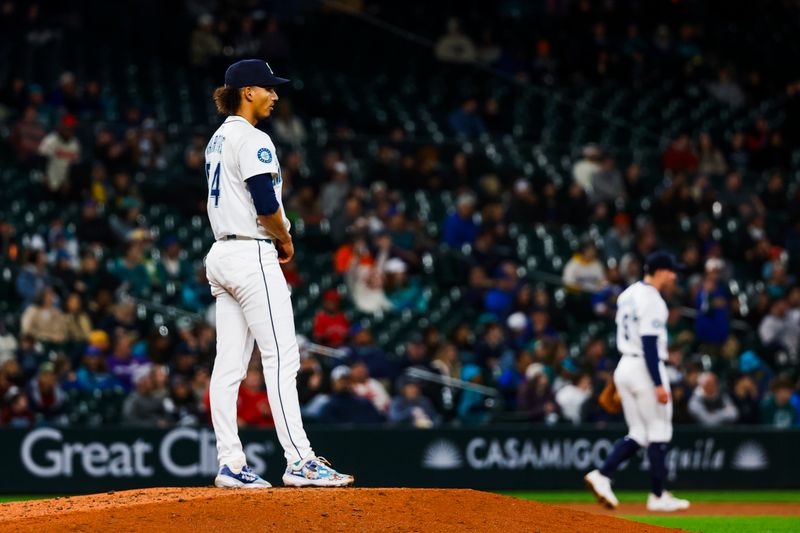 Apr 29, 2025; Seattle, Washington, USA; Seattle Mariners relief pitcher Carlos Vargas (54) stands on the mound after surrendering a solo-home run against the Los Angeles Angels during the seventh inning at T-Mobile Park. Mandatory Credit: Joe Nicholson-Imagn Images