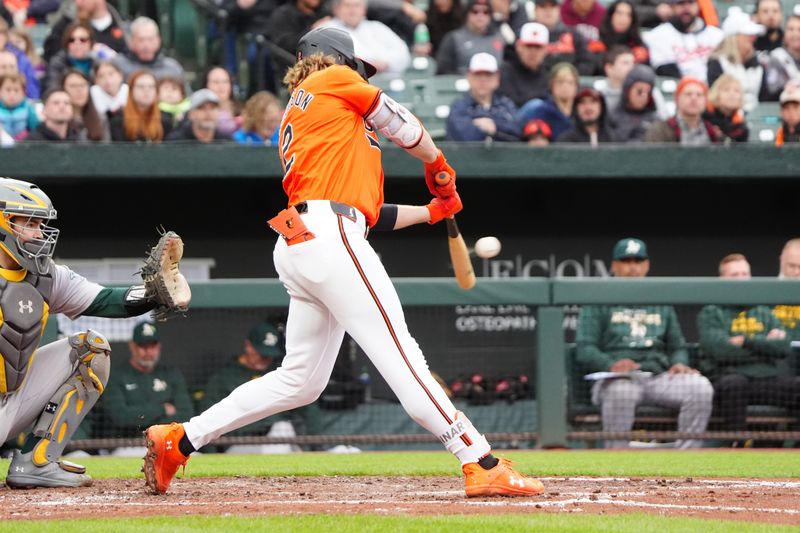 Apr 27, 2024; Baltimore, Maryland, USA; Baltimore Orioles shortstop Gunnar Henderson (2) hits a single against the Oakland Athletics during the fourth inning at Oriole Park at Camden Yards. Mandatory Credit: Gregory Fisher-USA TODAY Sports