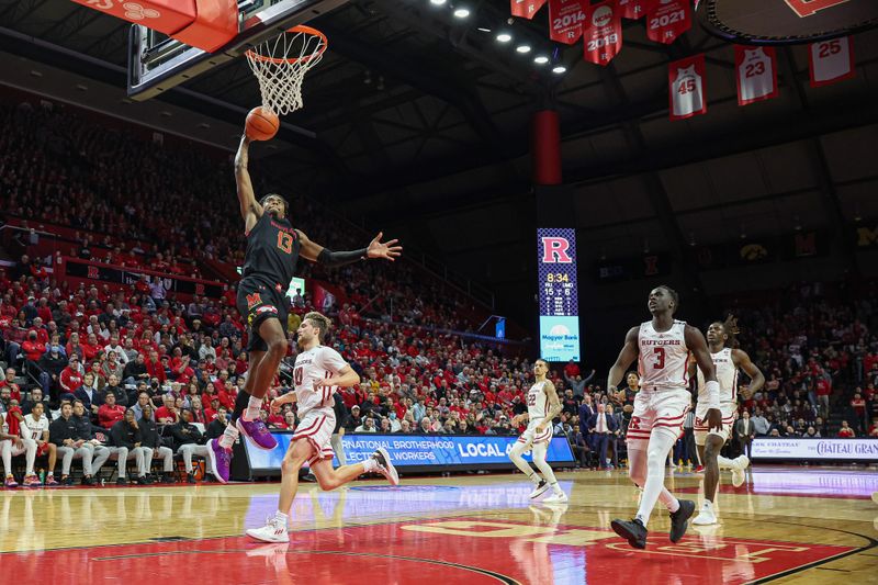 Jan 5, 2023; Piscataway, New Jersey, USA; Maryland Terrapins guard Hakim Hart (13) goes up for a dunk in front of Rutgers Scarlet Knights guard Cam Spencer (10) and forward Mawot Mag (3) during the first half at Jersey Mike's Arena. Mandatory Credit: Vincent Carchietta-USA TODAY Sports