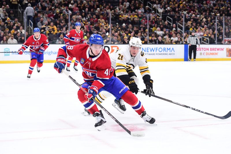 Jan 24, 2026; Boston, Massachusetts, USA; Montreal Canadiens defenseman Lane Hutson (48) and Boston Bruins center Alex Steeves (21) chase after the puck during the first period at TD Garden. Mandatory Credit: Bob DeChiara-Imagn Images