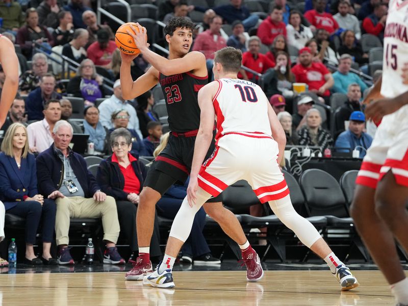Mar 9, 2023; Las Vegas, NV, USA; Stanford Cardinal forward Brandon Angel (23) protects the ball from Arizona Wildcats forward Azuolas Tubelis (10) during the first half at T-Mobile Arena. Mandatory Credit: Stephen R. Sylvanie-USA TODAY Sports