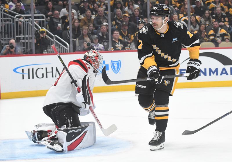 Nov 16, 2023; Pittsburgh, Pennsylvania, USA; Pittsburgh Penguins right wing Bryan Rust (17) scores on New Jersey Devils goalie Vitek Vanecek (41) during the first period at PPG Paints Arena. Mandatory Credit: Philip G. Pavely-USA TODAY Sports