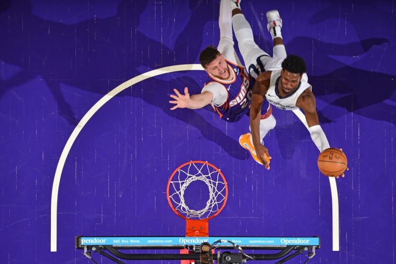 PHOENIX, AZ - JANUARY 7: Jaren Jackson Jr. #13 of the Memphis Grizzlies shoots the ball during the game against the Phoenix Suns on January 7, 2024 at Footprint Center in Phoenix, Arizona. NOTE TO USER: User expressly acknowledges and agrees that, by downloading and or using this photograph, user is consenting to the terms and conditions of the Getty Images License Agreement. Mandatory Copyright Notice: Copyright 2024 NBAE (Photo by Barry Gossage/NBAE via Getty Images)