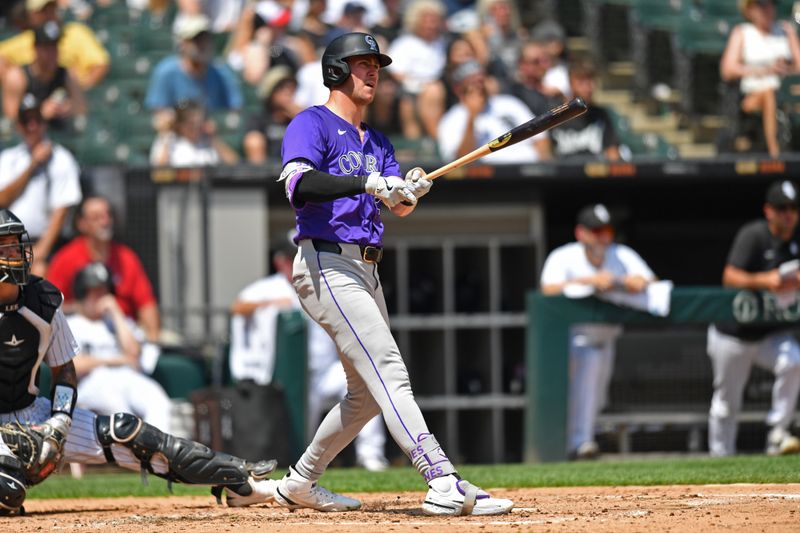 Jun 29, 2024; Chicago, Illinois, USA; Colorado Rockies left fielder Nolan Jones (22) watches his two-run home run during the fifth inning against the Chicago White Sox at Guaranteed Rate Field. Mandatory Credit: Patrick Gorski-USA TODAY Sports