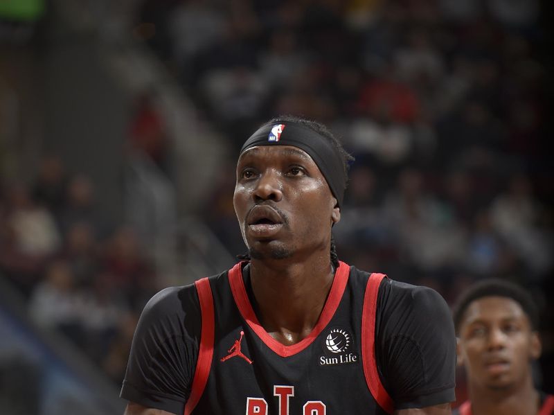 CLEVELAND, OH - NOVEMBER 24: Chris Boucher #25 of the Toronto Raptors prepares to shoot a free throw during the game against the Cleveland Cavaliers on November 24, 2024 at Rocket Mortgage FieldHouse in Cleveland, Ohio. NOTE TO USER: User expressly acknowledges and agrees that, by downloading and/or using this Photograph, user is consenting to the terms and conditions of the Getty Images License Agreement. Mandatory Copyright Notice: Copyright 2024 NBAE (Photo by David Liam Kyle/NBAE via Getty Images)