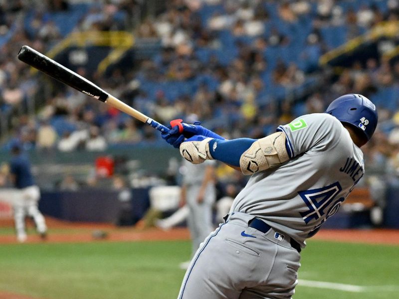 Sep 22, 2024; St. Petersburg, Florida, USA; Toronto Blue Jays second baseman Leo Jimenez (49) drives in a run with a sacrifice fly ball in the fourth inning against the Tampa Bay Rays at Tropicana Field. Mandatory Credit: Jonathan Dyer-Imagn Images