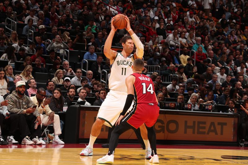 MIAMI, FL - NOVEMBER 26: Brook Lopez #11 of the Milwaukee Bucks handles the ball during the game against the Miami Heat during the Emirates NBA Cup game on November 26, 2024 at Kaseya Center in Miami, Florida. NOTE TO USER: User expressly acknowledges and agrees that, by downloading and or using this Photograph, user is consenting to the terms and conditions of the Getty Images License Agreement. Mandatory Copyright Notice: Copyright 2024 NBAE (Photo by Issac Baldizon/NBAE via Getty Images)