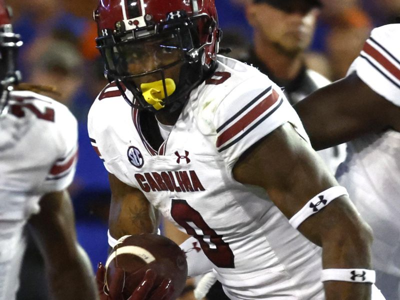 Nov 12, 2022; Gainesville, Florida, USA; South Carolina Gamecocks tight end Jaheim Bell (0) runs with the ball against the Florida Gators during the second half at Ben Hill Griffin Stadium. Mandatory Credit: Kim Klement-USA TODAY Sports